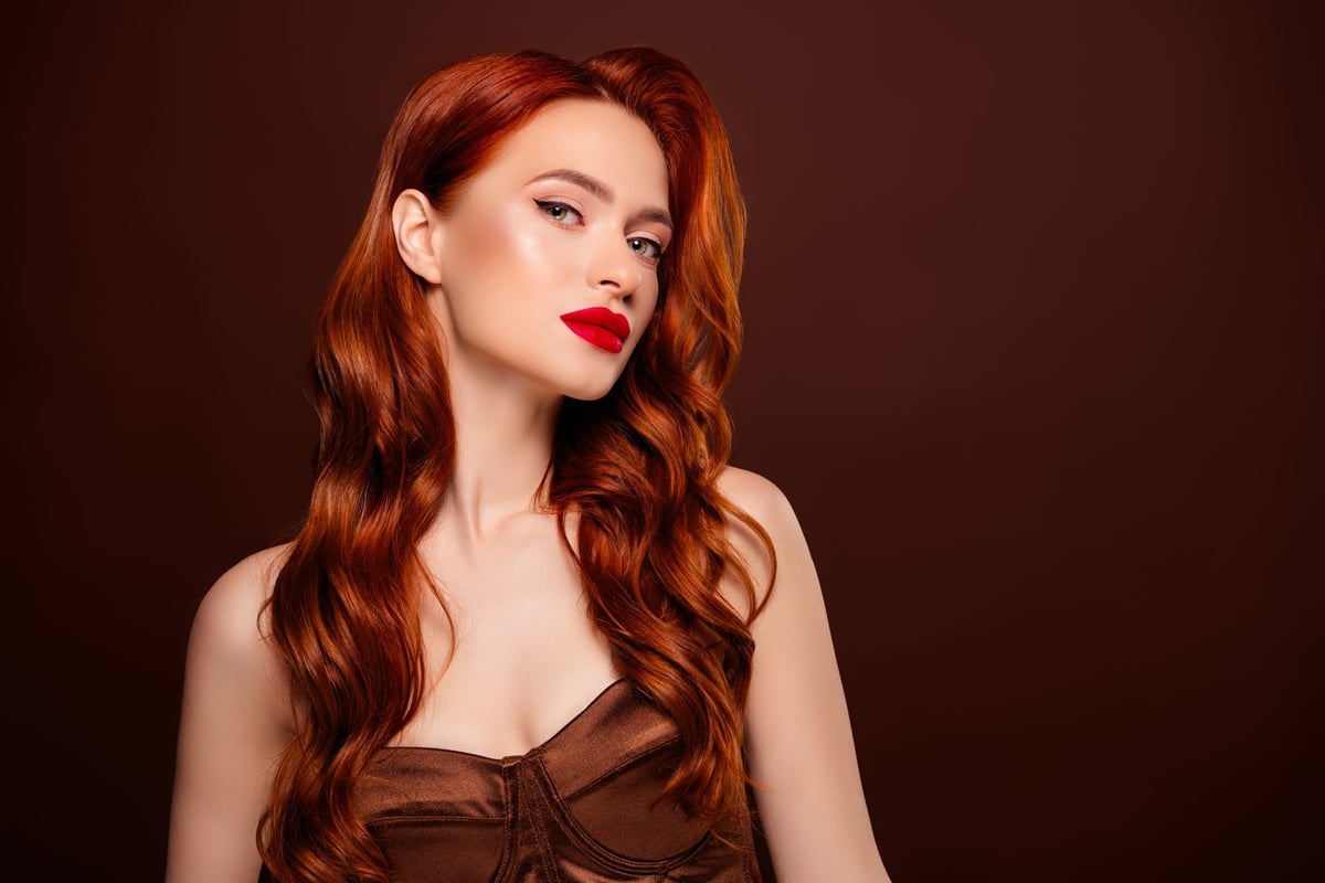 Photo of magnificent rich lady in fashionable clothes isolated on brown color background