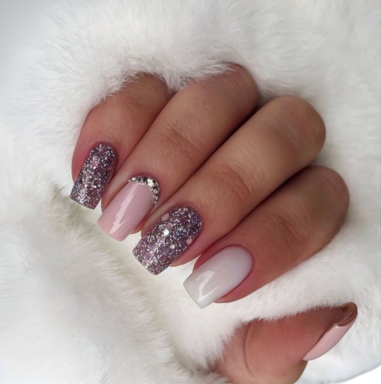 High quality detailed close-up of professional manicure showing beautifully styled nails with glossy polish and artistic nail art patterns